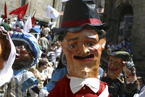 Parade of cabezudos during the Fiestas de la Ascensión